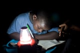 Solar powered lighting allows children to do school homework at night